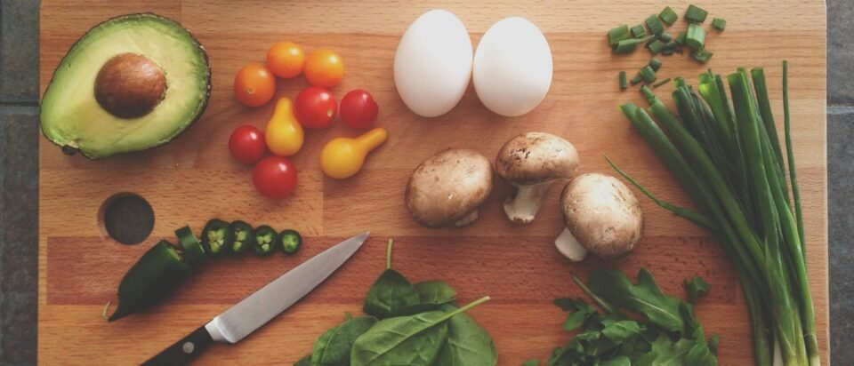 avocado, tomatoes, eggs, mushrooms, spring onions, and leaves